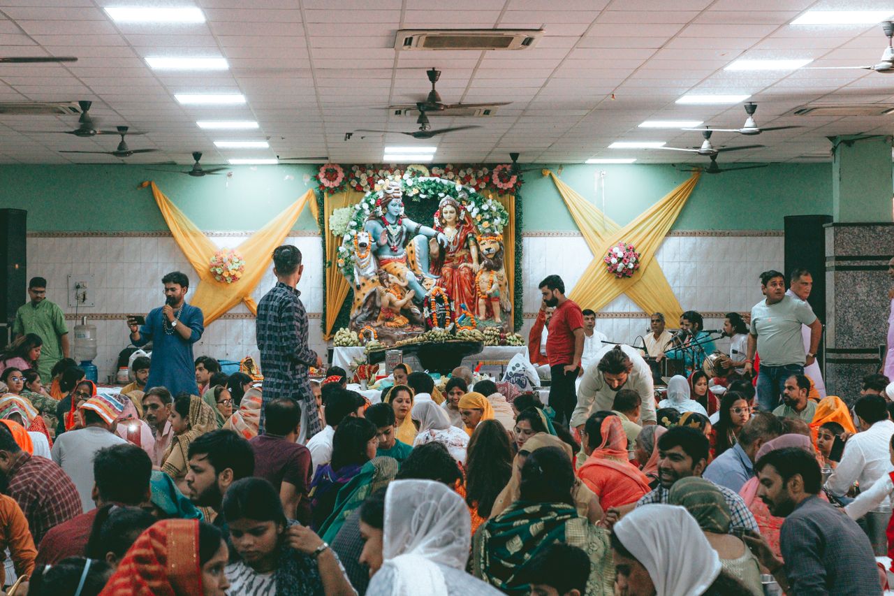 Visitors eating at a lit-up food festival